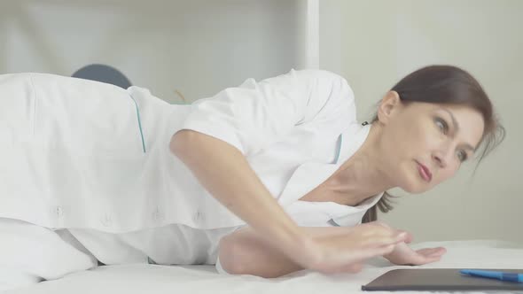 Restless Doctor Waking Up in Hospital Ward and Leaving. Portrait of Exhausted Medical Employee alt