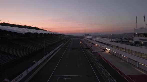 Aerial view of Hungaroring race track, main straight and pit boxes, after sunset