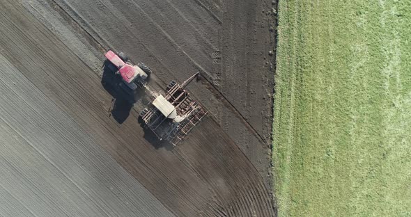 Agriculture, Farm Tractors Plow the Earth in Field, Dust in the Field, View From Height, Grain alt