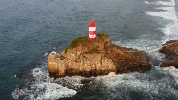 Drone View of the Picturesque Old Basargin Lighthouse on the Coast of the Sea alt