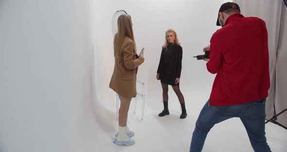 Photographers Working With A Model In The Studio