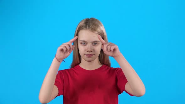 Cute Child Making Heart Shape with Hands and Then Blowing Kiss. Slow Motion alt