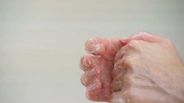 Close - Up of Hands. A Woman Washes Her Hands. Soap Bubbles and Foam. Concept of Hygiene, Control alt