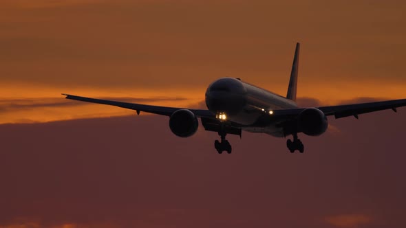 Airplane on Final Approach at Sunset alt