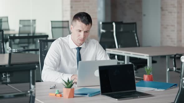 Manager Finish Project Sitting at Workspace alt