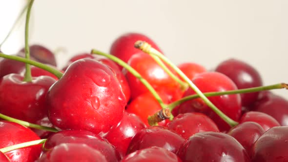 Lot of tart or draft red and fresh cherries pile food background 4K 2160p 30 fps slow tilt UHD video alt
