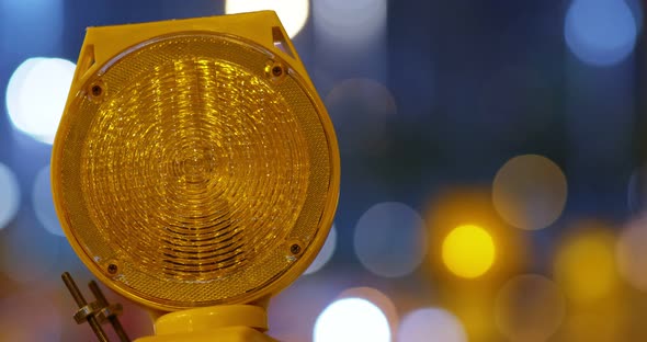 Yellow caution light at night alt