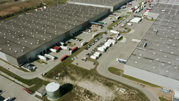 Trucks with Semi Trailers Stand Ramps Warehouses for Loading and Unloading Goods alt