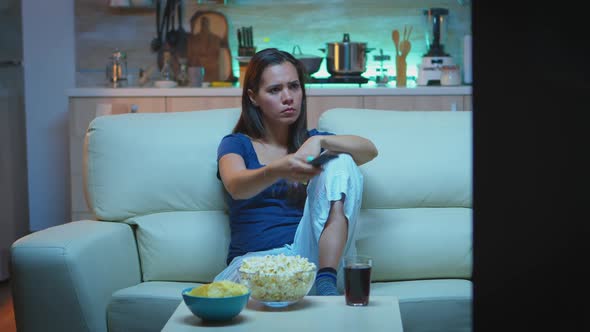 Nevous Lady Changing the Channels alt