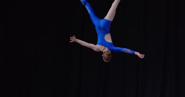 Beautiful Aerial Gymnastics Performance By a Young Girl Spinning Upside Down alt
