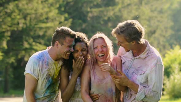 Laughing Faces of Soaking Wet Excited Friends Celebrating Holi Color Festival alt