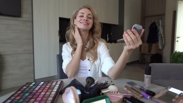 Young Beautiful Caucasian Woman Makeup Artist Paints Her Lips Using a Pencil and Chat Live with Her alt