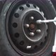 Man mechanic screwing up wheel bolts. After seasonal tire change. Fix, repair, car service concept f