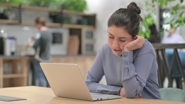 Tired Indian Woman Taking Nap While Working in Office alt