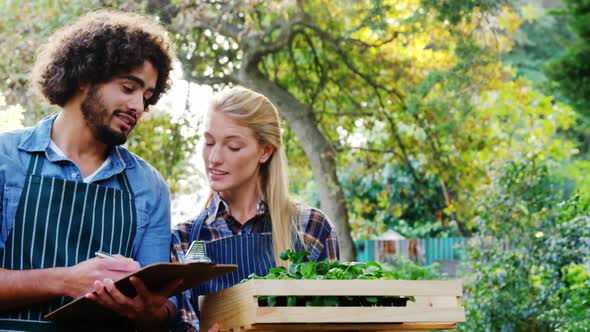 Man taking notes of plants alt