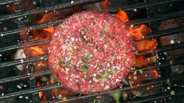 Super Slow Motion Top Shot of Seasoning Falling on Fresh Minced Meat at 1000 Fps alt