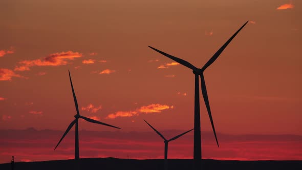 Windmills or Wind Turbine in Sunrise Light alt