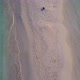 Aerial nature of seashore beach voyage by blue lagoon with sand background