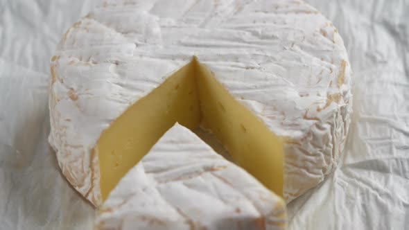 Rotating Camembert cream cheese, close-up, dairy product concept alt