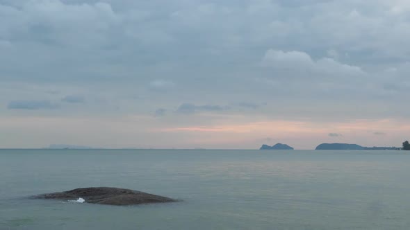 Beautiful Calm Blue Sea And Cloudy Sky At Sunset