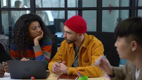 Multiracial Coworkers Communicating During Meeting alt