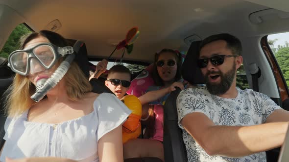 Crazy Funny Family with Children Traveling in the Car alt