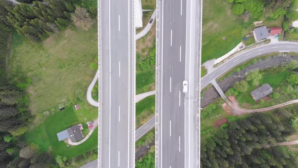 Aerial Top View of Highway Viaduct with Multilane Traffic in Mountains. Autobahn in Austria alt