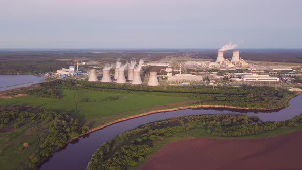Nuclear power plant cooling towers emissions of steam in the air atmosphere alt
