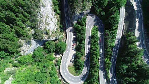 Aerial Traffic Between Mountains Road