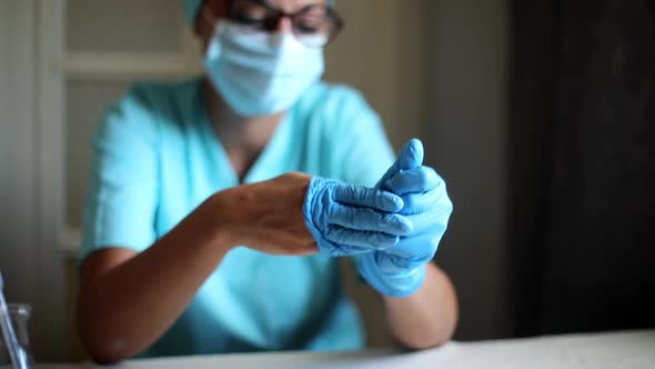 Doctor taking off the gloves