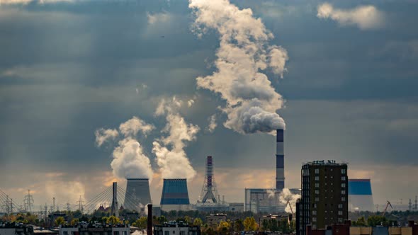 Smoke From Chimneys Forms Clouds. A Lot of Pipes in Industrial, Residential Area, Timelapse. Large