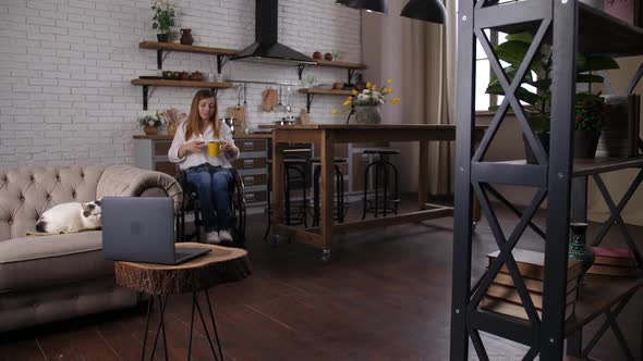 Disabled Woman Moving Around House in Wheelchair alt