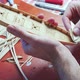 Hands of Man Adjusts Plywood Details for Ship Model Grinding on Sandpaper - VideoHive Item for Sale