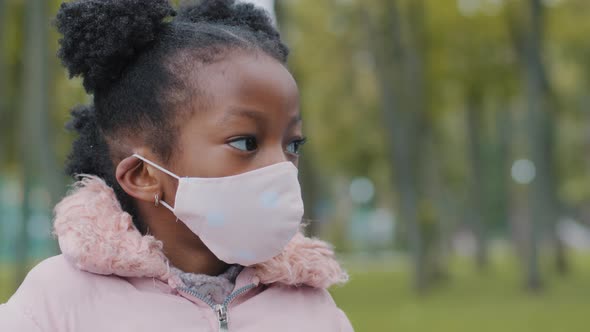 City Portrait Little Serious Sad Cute African American Girl Afro Child Kid Standing in Street alt