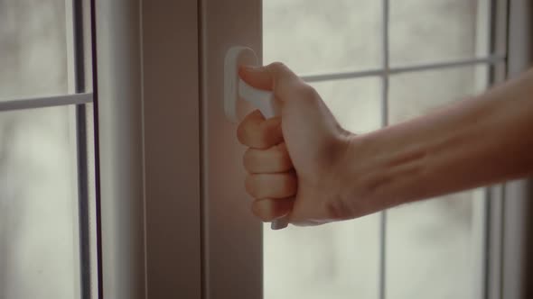 Light Apartment Room In Winter. Open Vinyl Frame In Bright Room Interior.Man Hand Open Closed Window alt