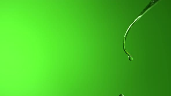 Super Slow Motion Macro Shot of Water Droplet Falling From Fresh Green Leaf at 1000Fps alt