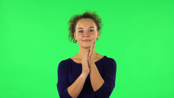 Portrait of Curly Woman Claps Her Hands. Green Screen alt