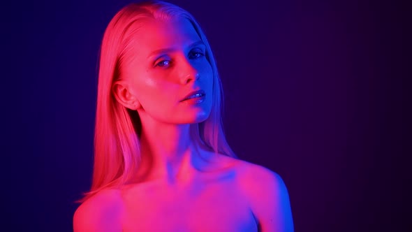 Naked Young Blonde Woman Posing in Neon Light