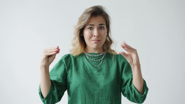 Slow Motion of Stressed and Annoyed Woman Making Bla Bla Bla Hand Gesture Expressing Dissatisfaction alt