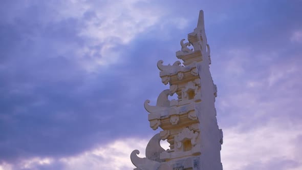 View on Balinese Hindu Gate in Front of Beautiful Sky with Clouds alt