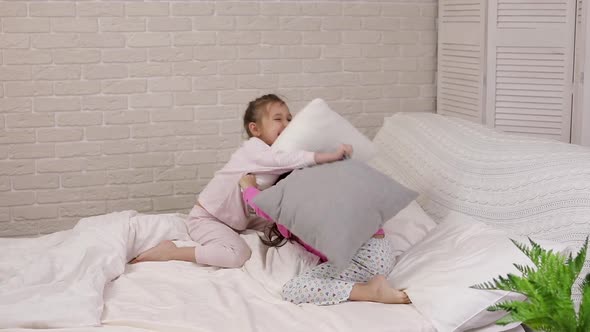 Two Cute Children Girls Playing in the Bedroom