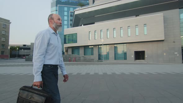 Handsome Caucasian Man of Retirement Age in Casual Shirt and Jeans Intelligent Pensioner or Bearded alt