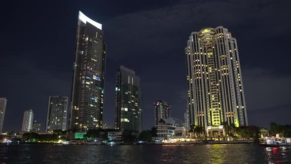 Business Center at Night, High-Rise Buildings on The River Bank. Skyscrapers alt