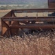 Closeup of a Combine Harvester Cutting a Wheat Crop in a Rural Field - VideoHive Item for Sale