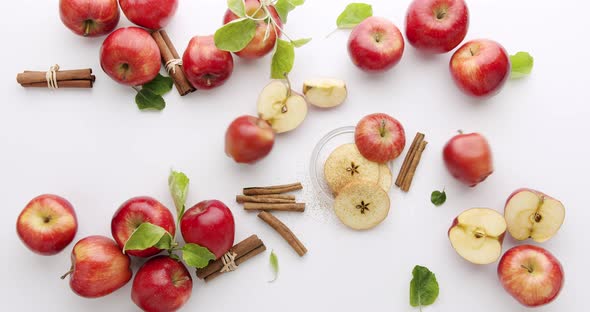 Red Natural Apples with Slice and Leafs Cinnamon Concept on White Background alt