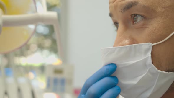 Orthodontist Covering Special Gel on Woman Teeth and Drying It in Dentistry Before Braces Installing alt