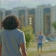 Darkskinned Man Walks Through the Summer City - VideoHive Item for Sale