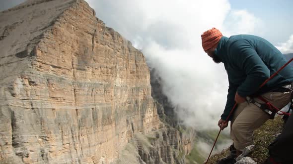 Climber Pulls a Rope in the Mountains. Rescue Operations in the Mountains