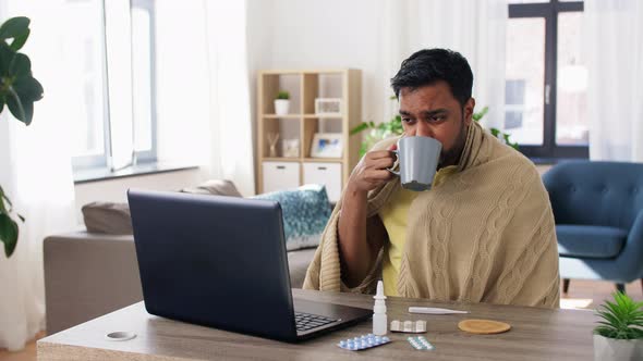 Sick Indian Man Having Video Call on Laptop alt