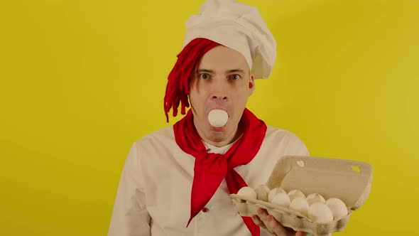 A Man with Red Dreadlocks Stands with a Chicken Egg in His Mouth alt
